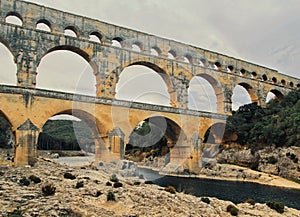 Pont du gard, an ancientÂ Roman aqueductÂ bridge built in the first century AD to carry water to the city of Nimes, France